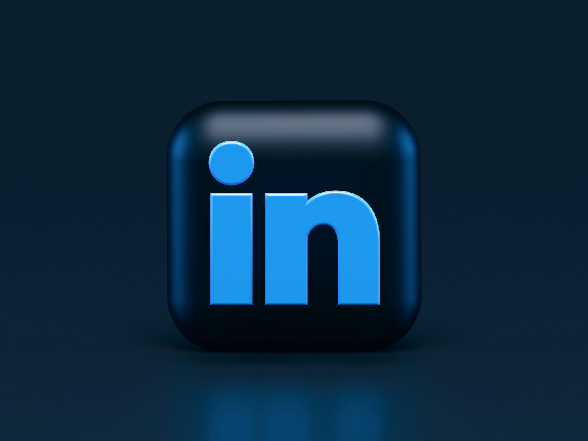 A blue LinkedIn logo icon on a dark blue background